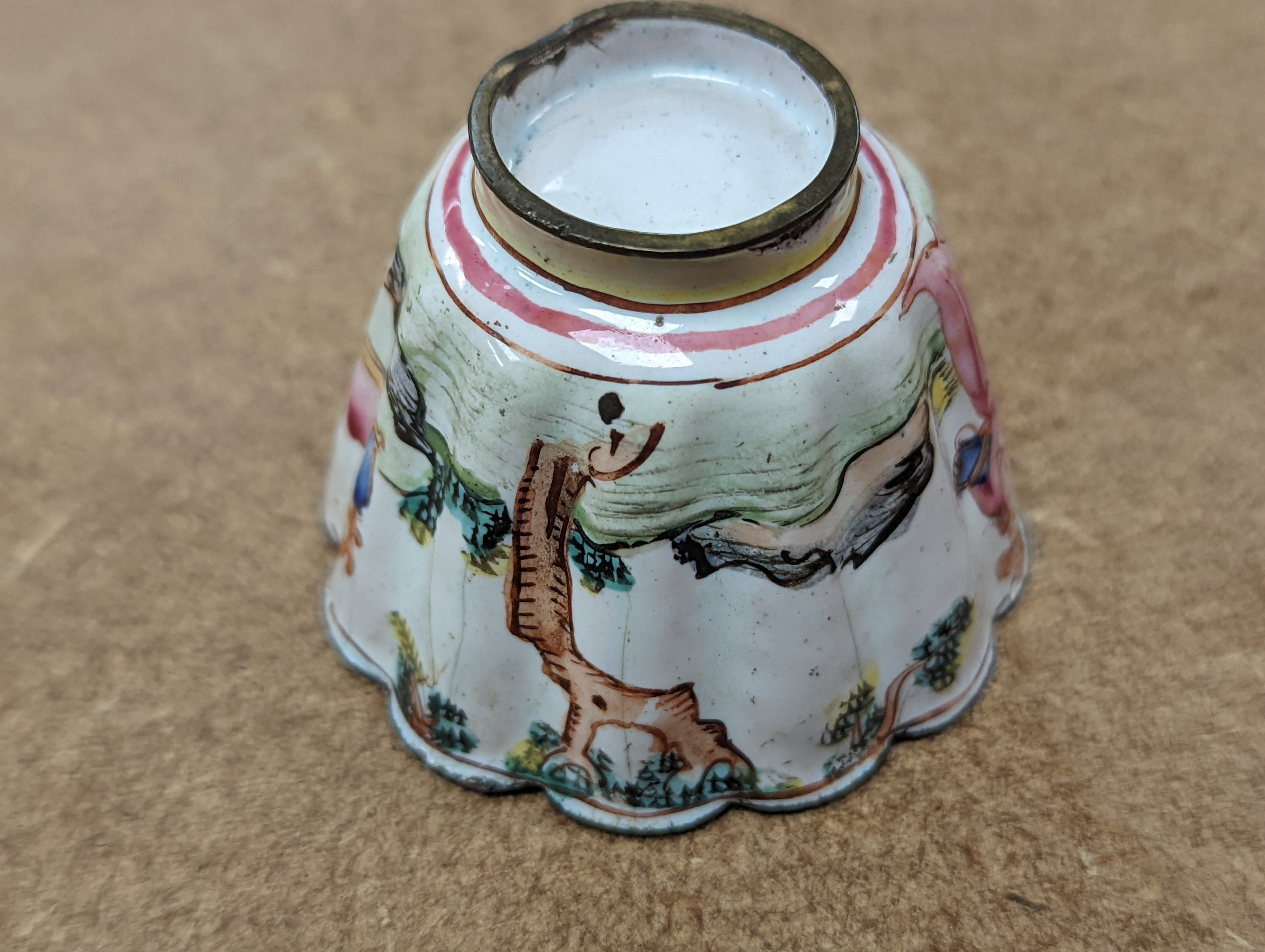 Two 18th century Chinese Canton enamel cups, and a 19th century Canton enamel oval snuff box, 5.8cm